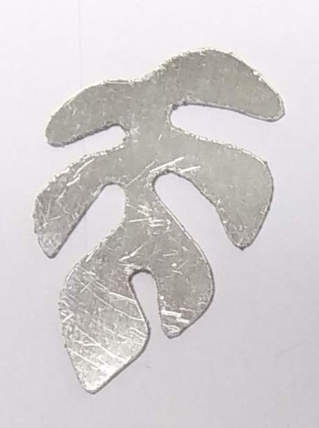 Judy Larson's Tropical Leaf Earrings - , Contemporary Wire Jewelry, Sawing, Saw, Wire Saw, Texturing, It was then scanned and the scanned image reversed.